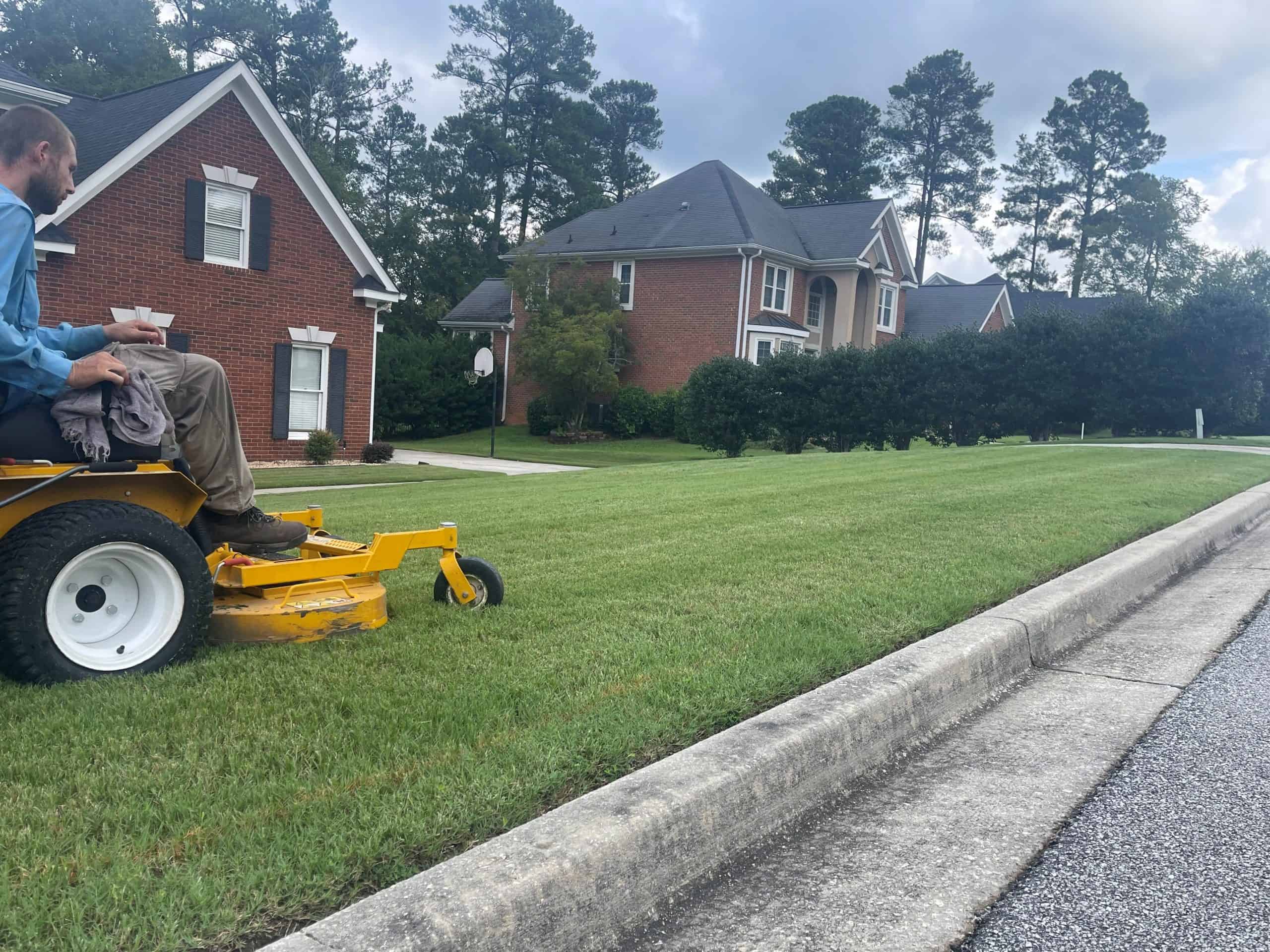 Professional lawn mowing on a residential property